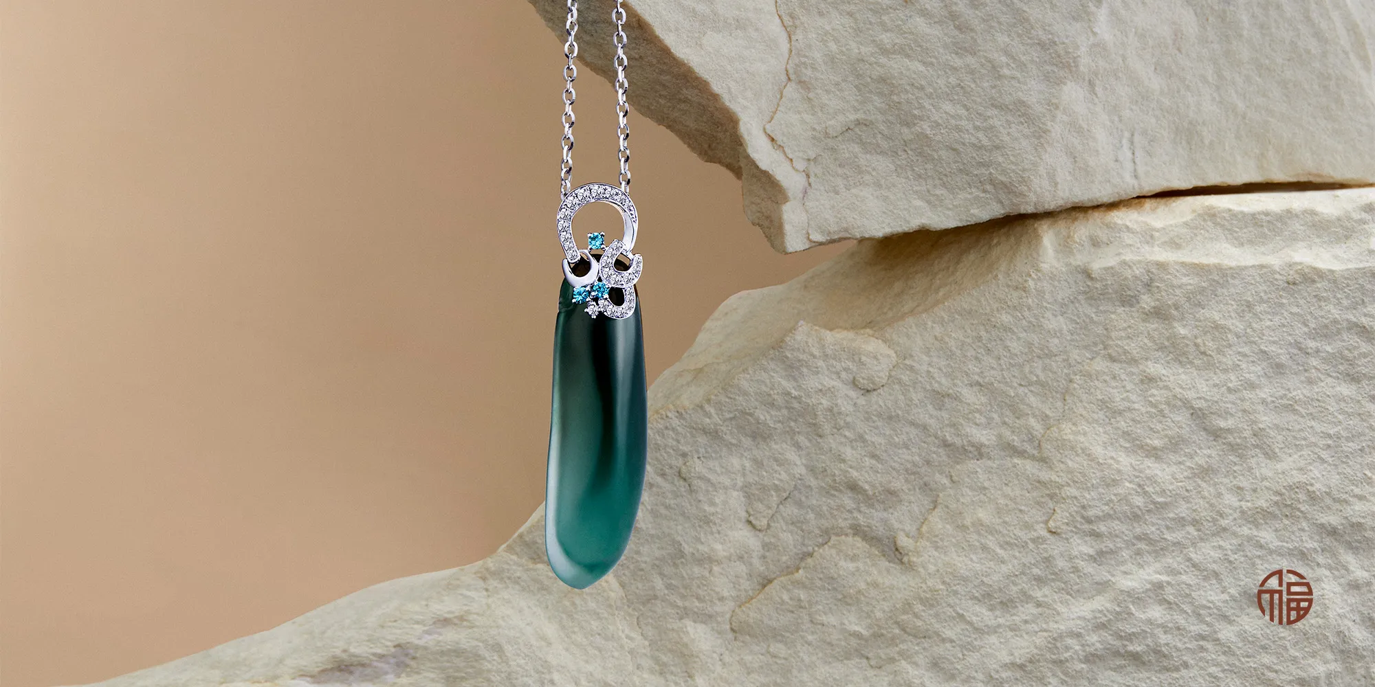 Exhibiting an exceptionally rare blue-green tone, this luminous jadeite embodies longevity. Suspended from diamond-lined horseshoes, it carries good luck and prosperity, making each piece as meaningful as it is beautiful.